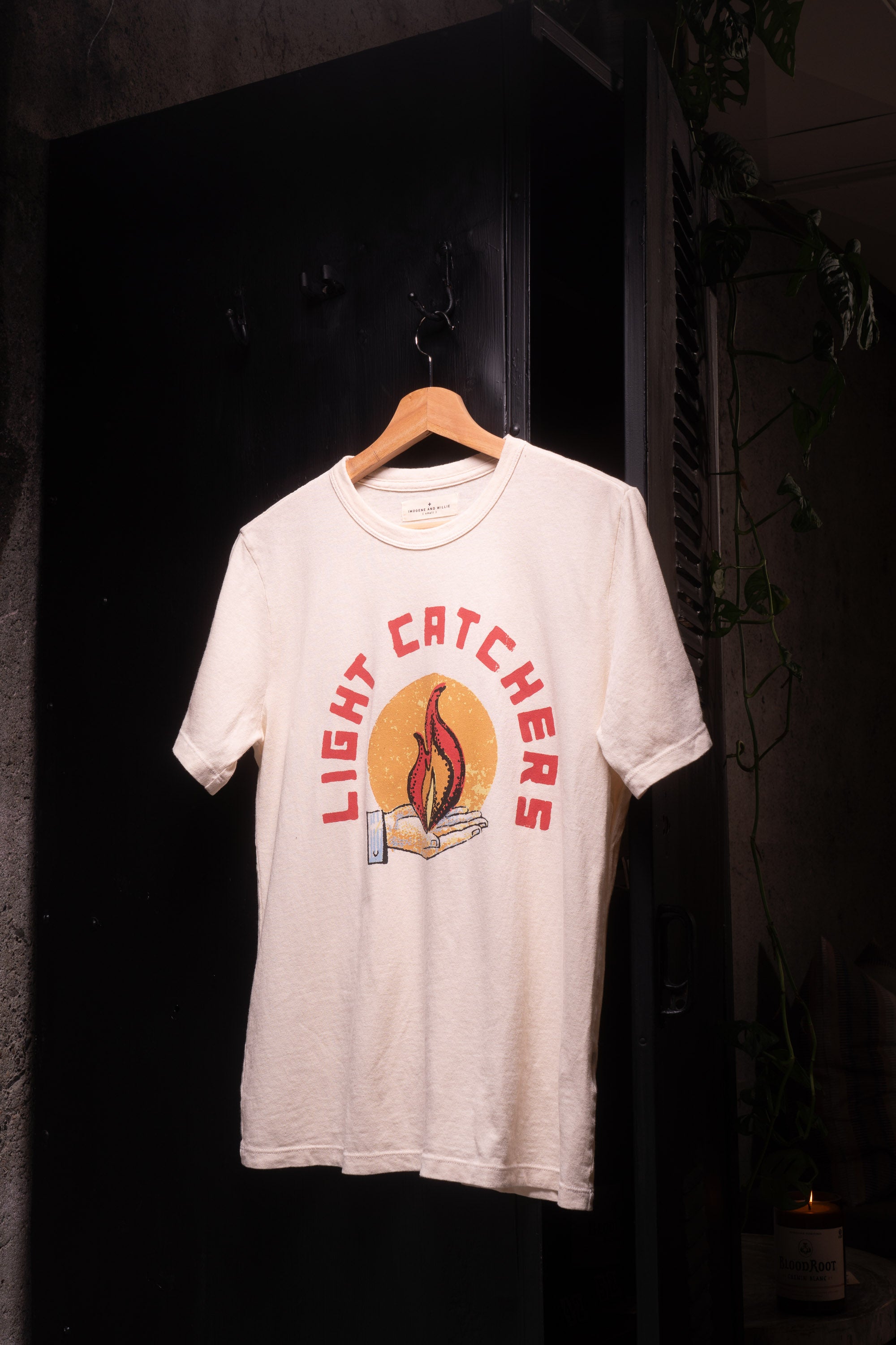 White t-shirt with light catchers logo