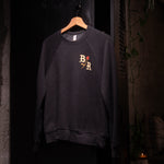 Letters BR with rose design on front of dark gray crew neck sweatshirt